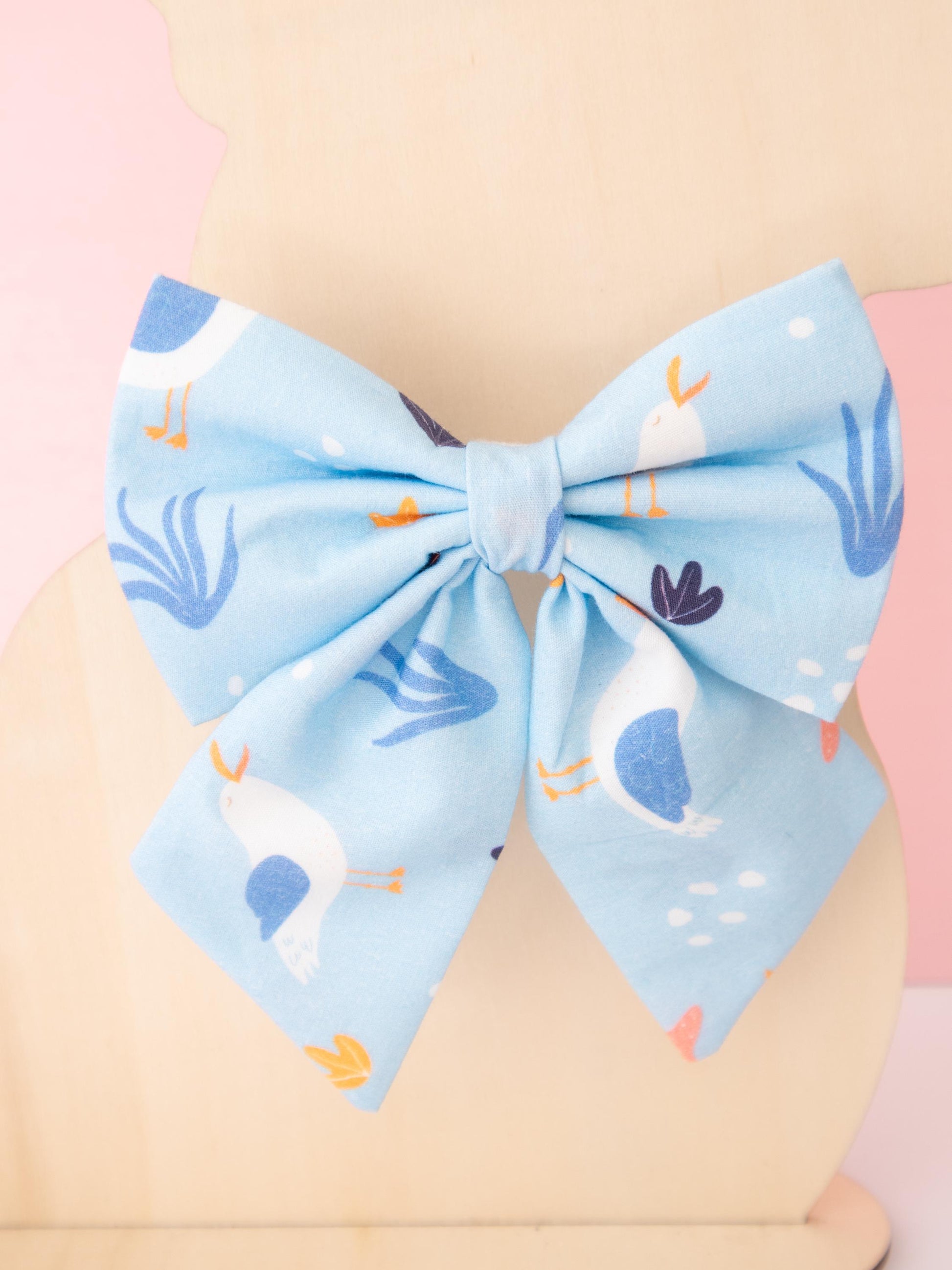 Large blue bow with animal pattern on a beige background