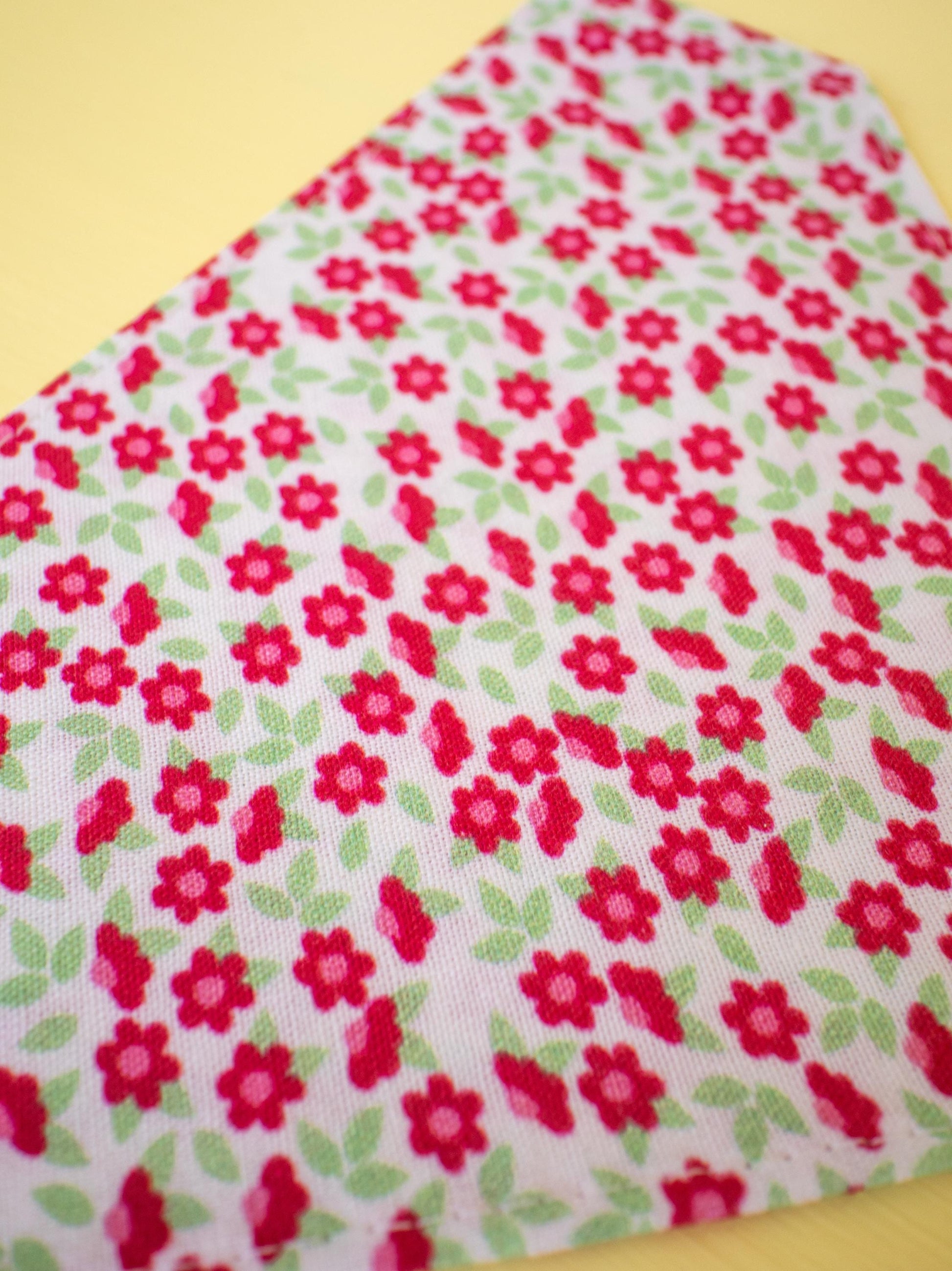 Floral fabric with red flowers on a white background