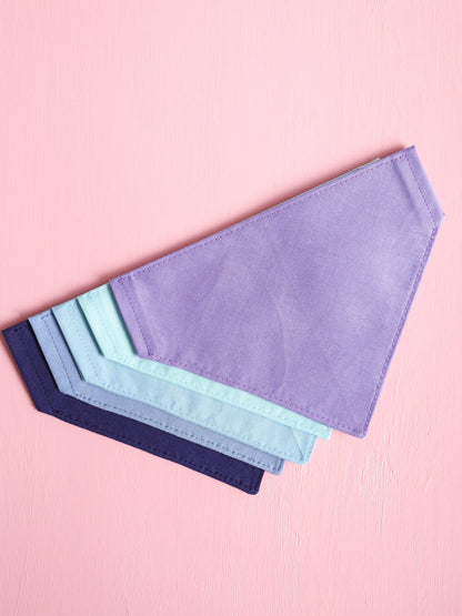 Set of colorful fabric swatches on a pink background