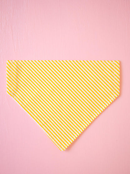 Yellow striped bandana on a pink background