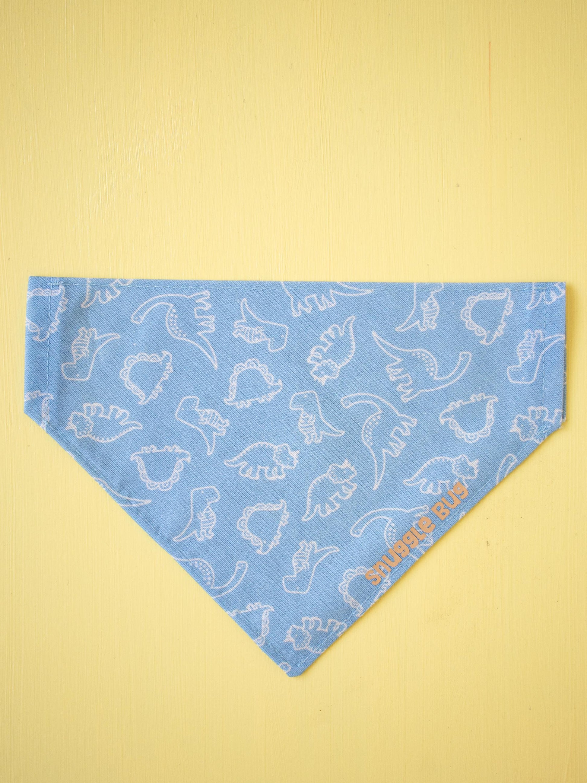 Blue bandana with white dinosaur pattern on a yellow background