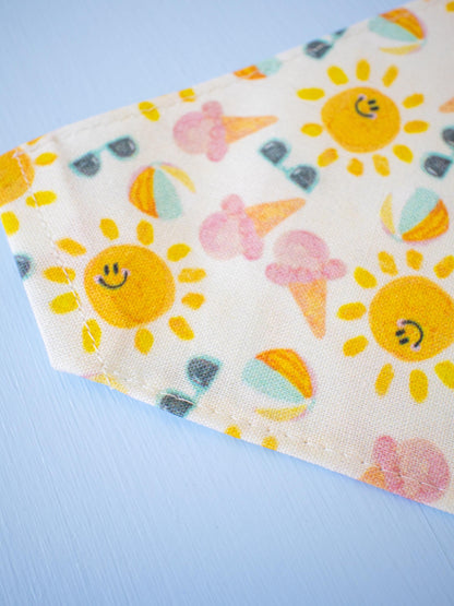 Fabric with sun and ice cream pattern on a blue background