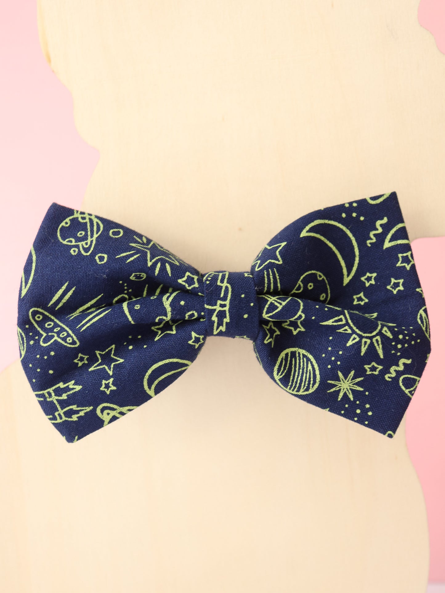 Bow tie with space-themed pattern on a mannequin head