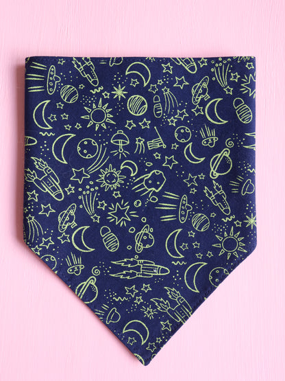 Navy blue bandana with green space-themed pattern on a pink background