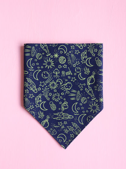 Navy blue bandana with green space themed pattern on a pink background