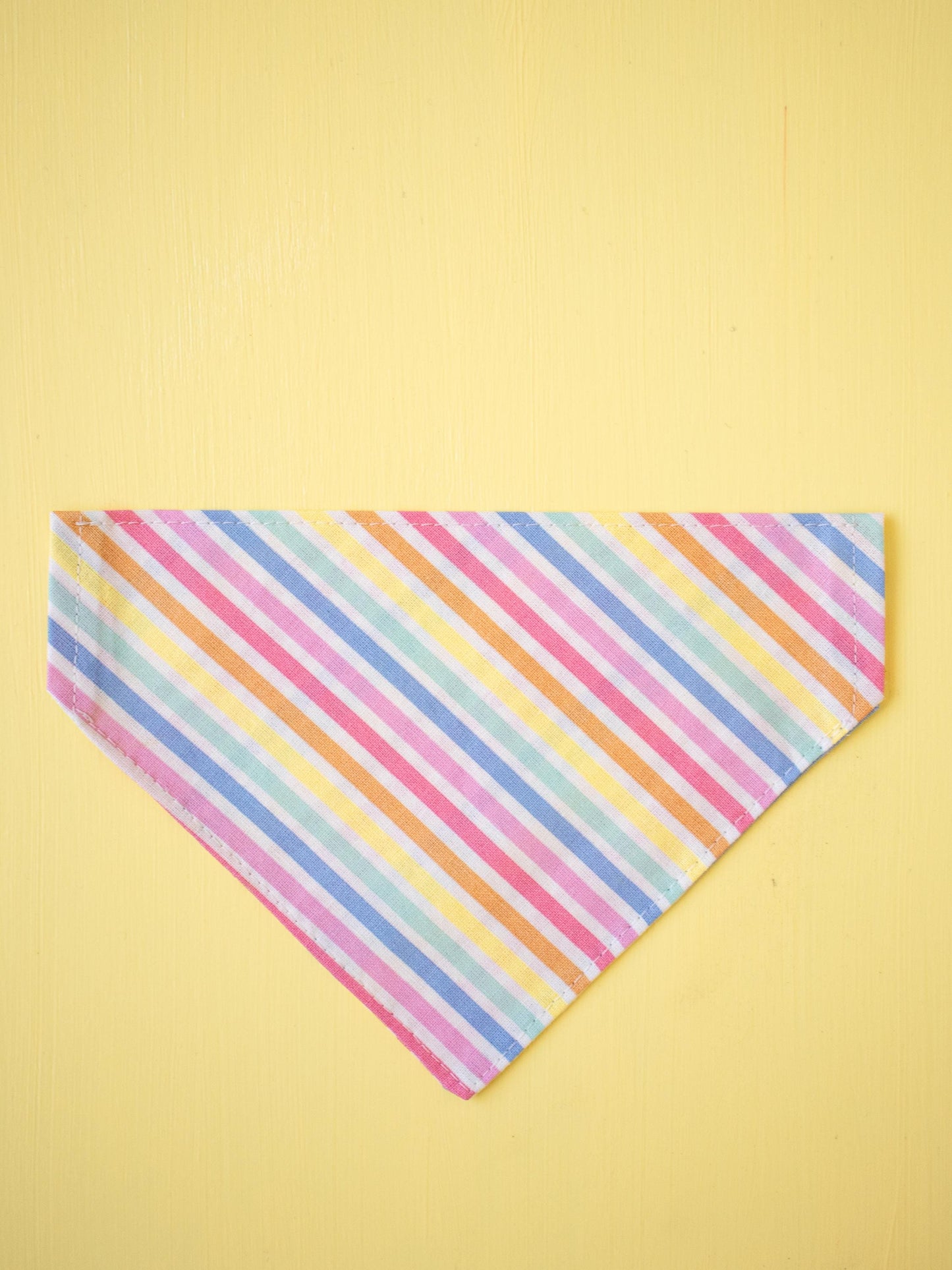 Multicolored striped bandana on a yellow background