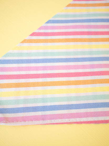 Colorful striped fabric on a yellow background